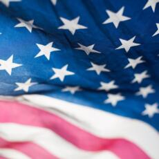 a close up of an american flag with stars.