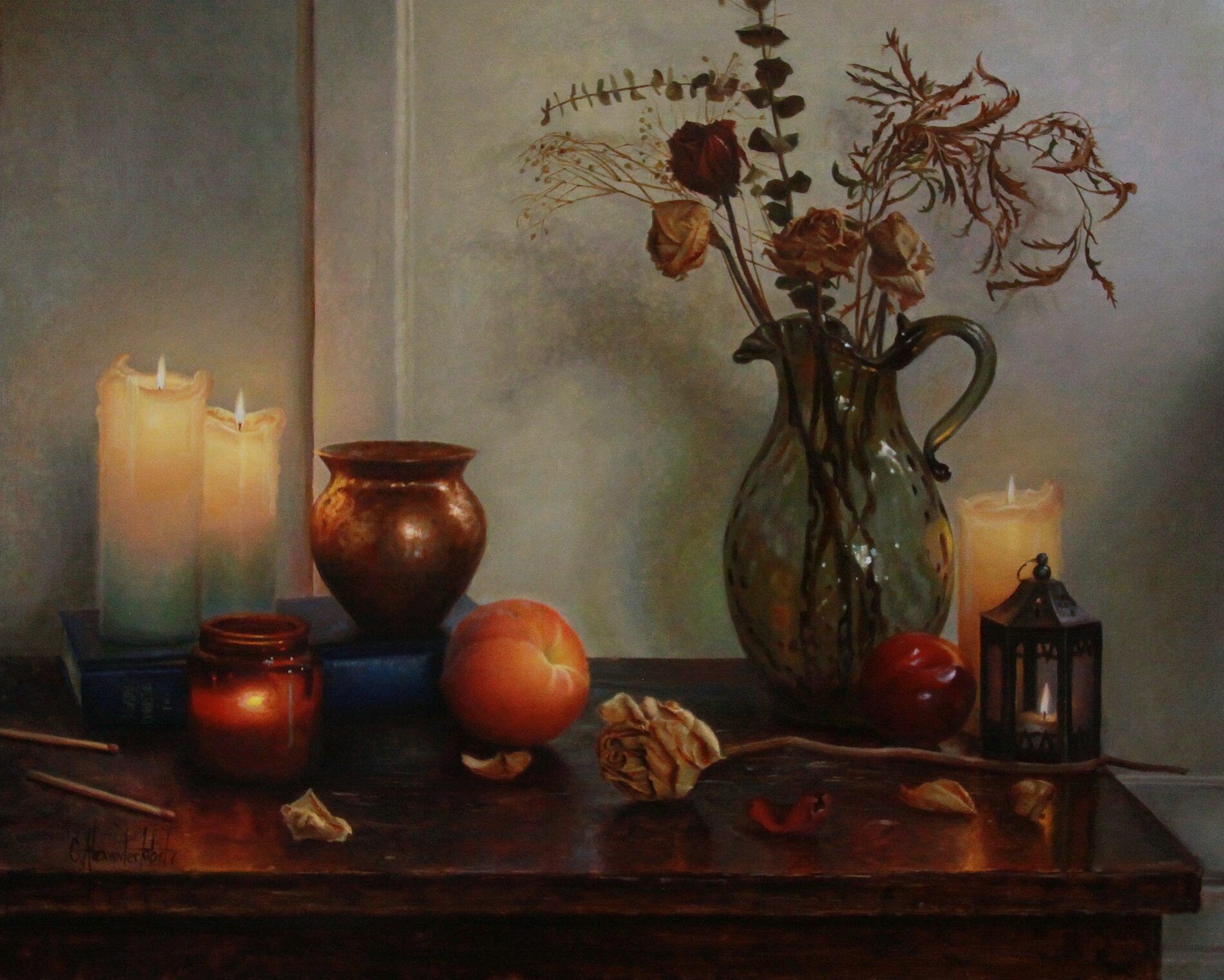 A table with a vase of flowers, lit candles, a peach, an apple, long matches, and a dead flower on a table.