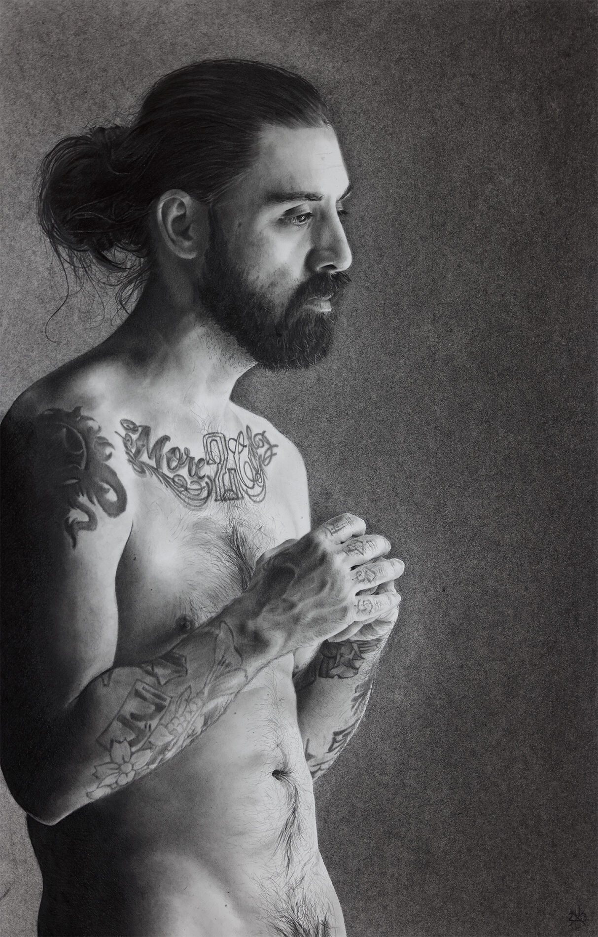 Black and white: nude man from the hips up. He has tattoos across his arms, which are loosely clasped near his also-tatooed chest, and he has a beard and long hair in a bun..