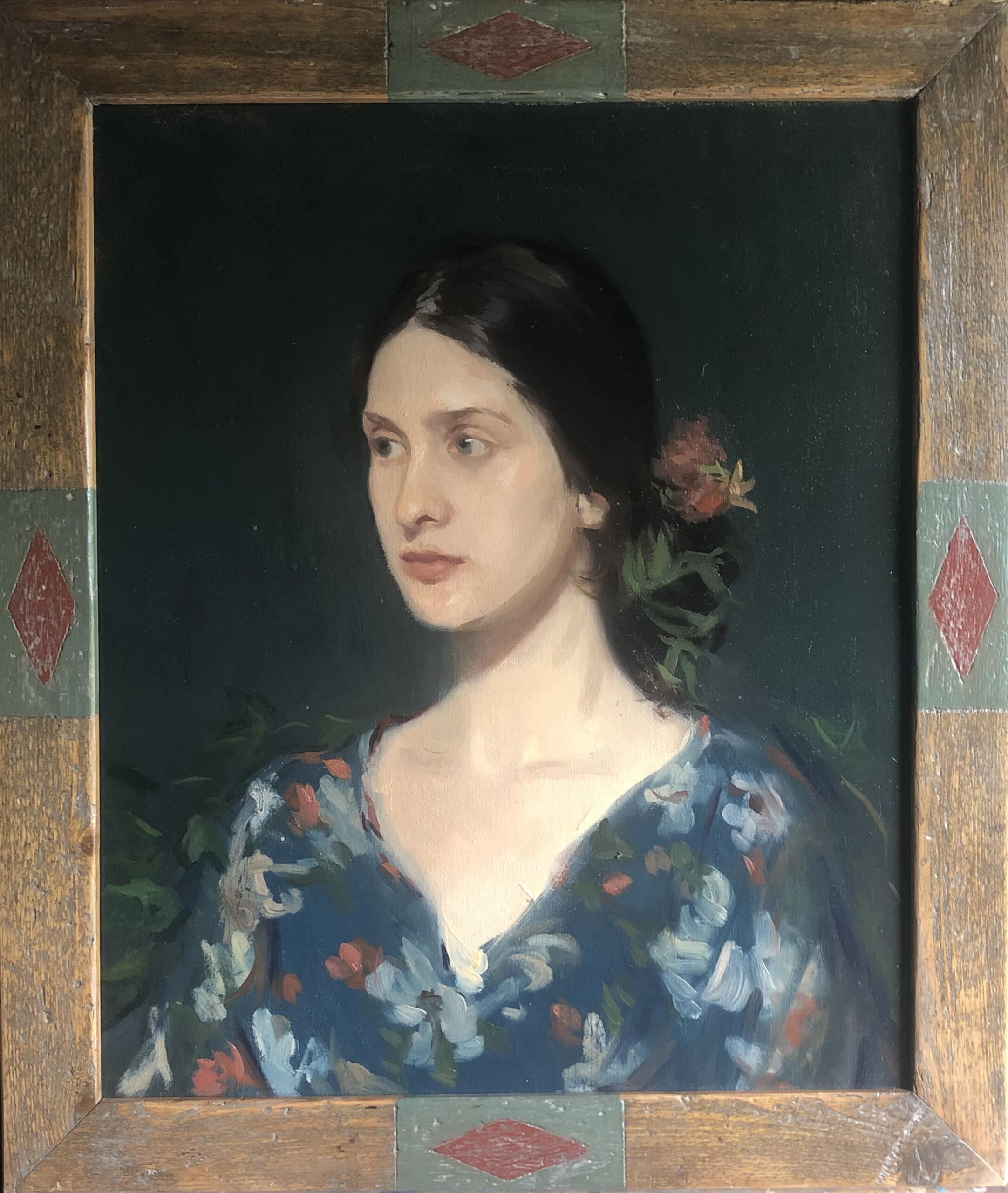 "Caterina as Persephone" in a distressed, wooden frame with a aqua rectangle with a red diamond inside in the center of each side.