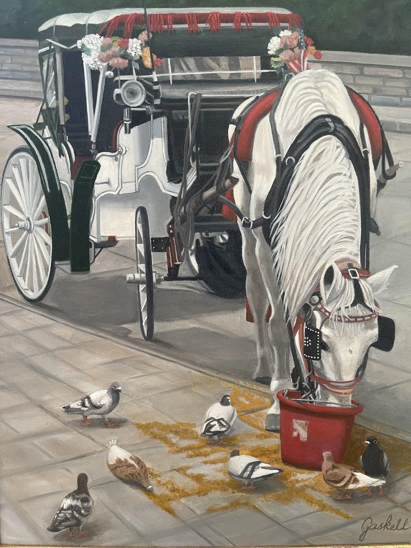 A horse connected to a carriage eating out of a bucket at the edge of a sidewalk, where pigeons are gathering.