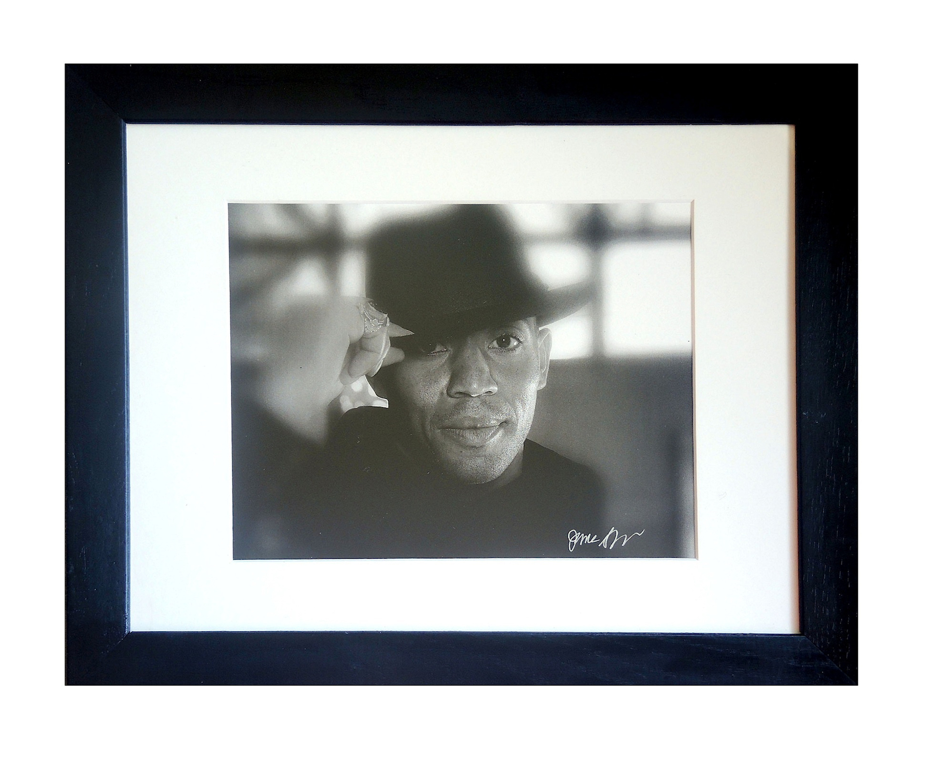 "Hi, There" in a white matte and black frame.
