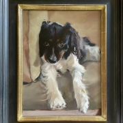 "Audrey" in a black frame with a golden inner edge.