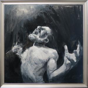 A painting of a bearded man screaming passionately above in a white frame.