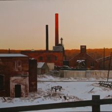 A painting of a factory in the snow.